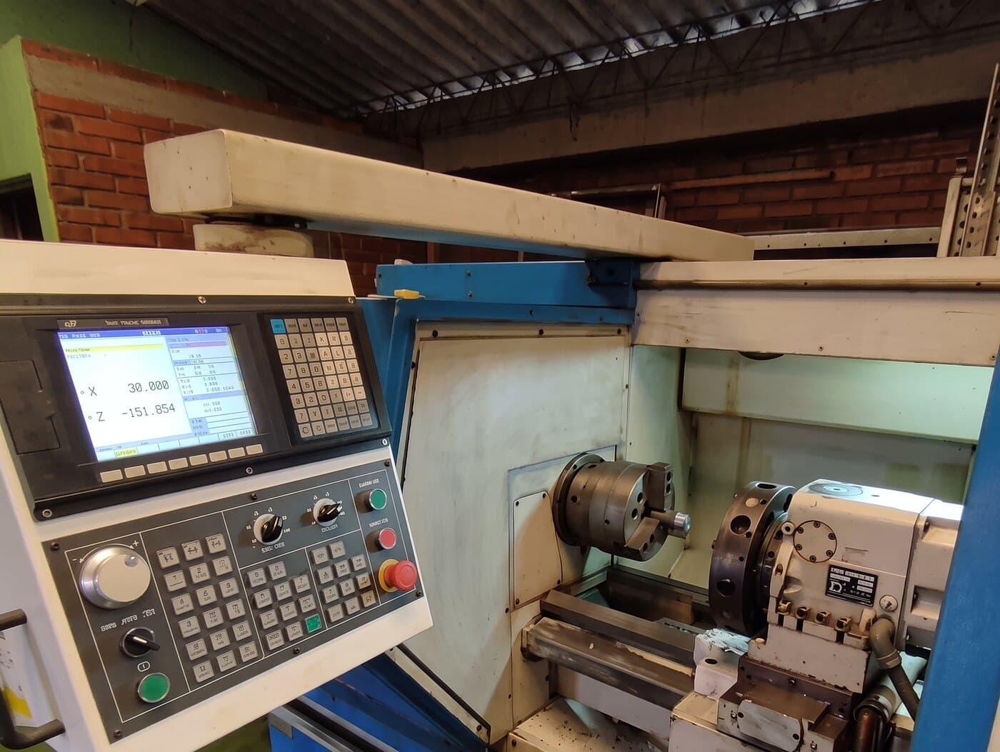 CNC lathe retrofitted with a new control, showing live axis positions